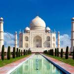 Taj mahal on a bright day in Agra, India - A monument of love in clear blue sky