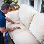 sofa cleaning by man