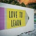 love to learn sign outside PhD university
